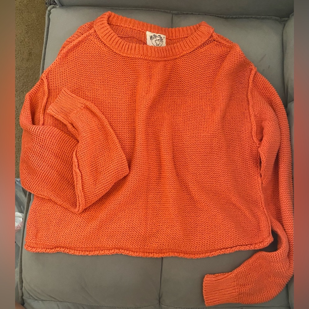 Knitted orange sweater